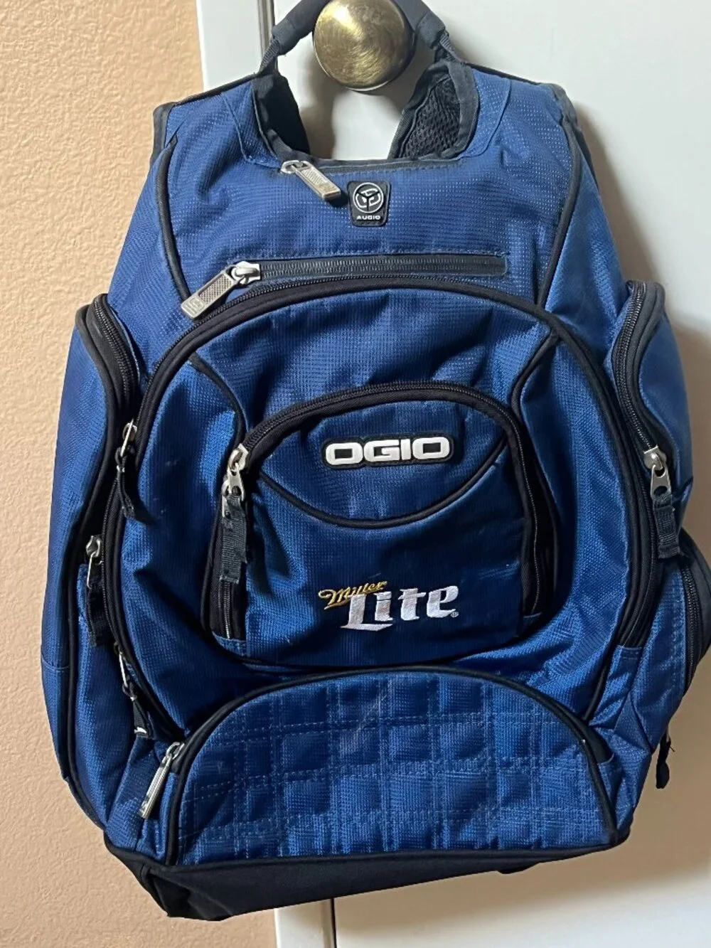 blue OGIO Metro backpack with embroidered Miller Lite branding